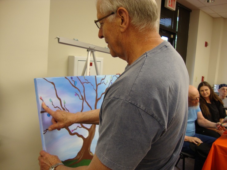 Survivors left their mark on a special art project commemorating the different types of cancers they had overcome. They added their fingerprints to a Tree of Life in the color that corresponded to their cancer. (Submitted photo courtesy MMC)