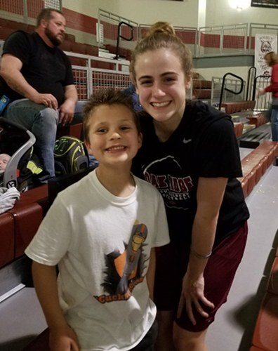 AJ Cucksey meets Oak Ridge Lady Wildcats senior Courtney Ellison during a Region 2-AAA quarterfinal game at Wildcat Arena in February 2017. (Photo courtesy Prayers for AJ)