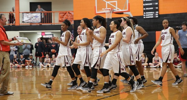 The Oak Ridge Lady Wildcats celebrate after winning the District 3-AAA girls' basketball championship in a 59-34 victory over Powell at Clinton High School on Tuesday, Feb. 21, 2017. (Photo by Luther Simmons)