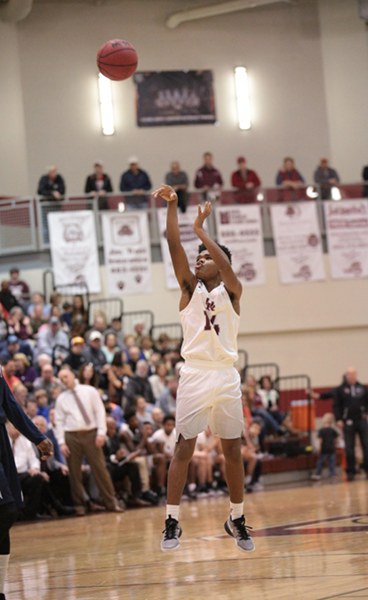 Oak Ridge sophomore Herbert Booker (14) shoots the basketball during a 68-38 Region 2-AAA quarterfinal win against West at Wildcat Arena on Saturday, Feb. 25, 2017. (Photo by Luther Simmons)