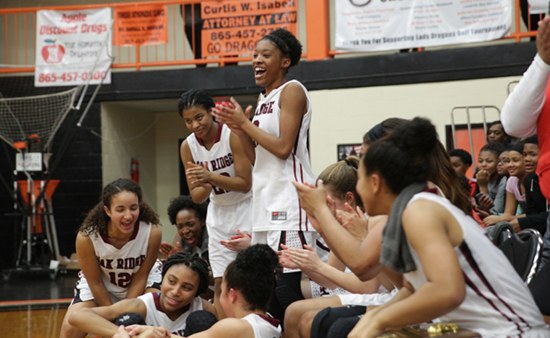 The Oak Ridge Lady Wildcats celebrate after winning the District 3-AAA girls' basketball championship in a 59-34 victory over Powell at Clinton High School on Tuesday, Feb. 21, 2017. (Photo by Luther Simmons)