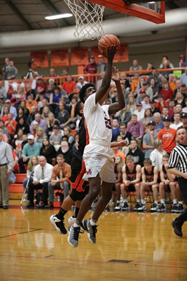 Oak Ridge was led by senior Anthony Gibson (23) with a game-high 24 points during an 86-58 win over Powell in the District 3-AAA championship at Clinton High School on Tuesday, Feb. 21, 2017. (Photo by Luther Simmons)