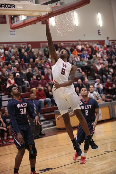 Oak Ridge senior Tee Higgins (5) goes for a layup during a 68-38 Region 2-AAA quarterfinal win against West at Wildcat Arena on Saturday, Feb. 25, 2017. (Photo by Luther Simmons)