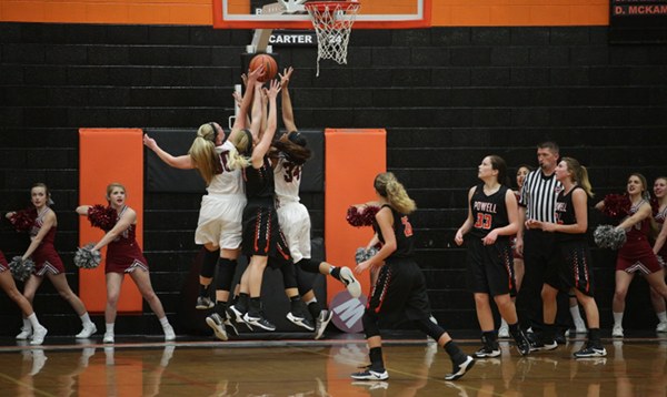 Oak Ridge juniors Destiny Kassner (30), left in white, and Mykia Dowdell (34), right in white, are pictured above during a 59-34 win over Powell at Clinton in the District 3-AAA championship at Clinton on Tuesday, Feb. 21, 2017. (Photo by Luther Simmons)