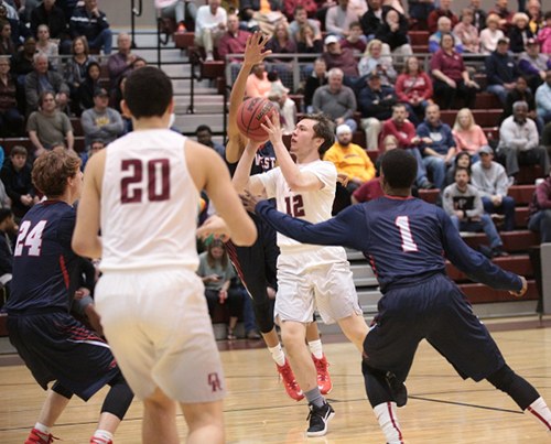 Oak Ridge sophomore Joe Kesterson (12), who is developing a reputation for making three-point shots, shoots the basketball during a 68-38 Region 2-AAA quarterfinal win against West at Wildcat Arena on Saturday, Feb. 25, 2017. (Photo by Luther Simmons)