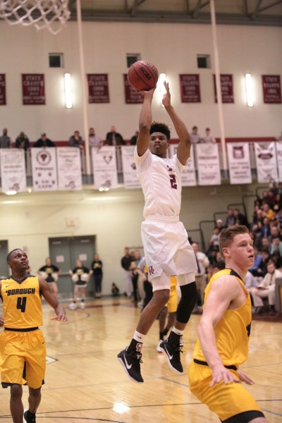 Oak Ridge senior E.J. Bush (2), playing for the first time in about three months after a knee injury in December, shoots the basketball during a 90-60 win for the Wildcats in a Class AAA sectional at Wildcat Arena on Monday, March 6, 2017. (Photo by Luther Simmons)
