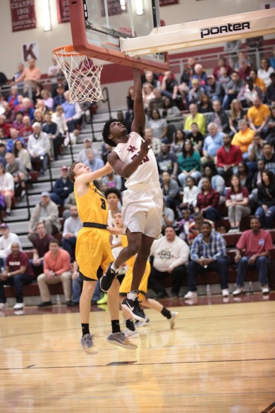 Oak Ridge senior Anthony Gibson (23) drives against David Crockett during a 90-60 win for the Wildcats in a Class sectional at Wildcat Arena on Monday, March 6, 2017. (Photo by Luther Simmons)