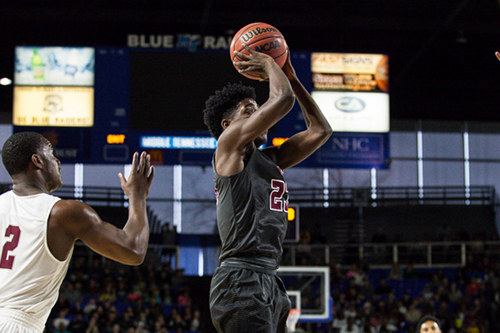 Oak Ridge senior Anthony Gibson (23) shoots the basketball in front of Memphis East junior Alex Lomax (2) during a 63-60 loss for the Wildcats in a Class AAA boys' state semifinal game at Murphy Center in Murfreesboro on Friday, March 17, 2017. (Photo by Kindell Moore)