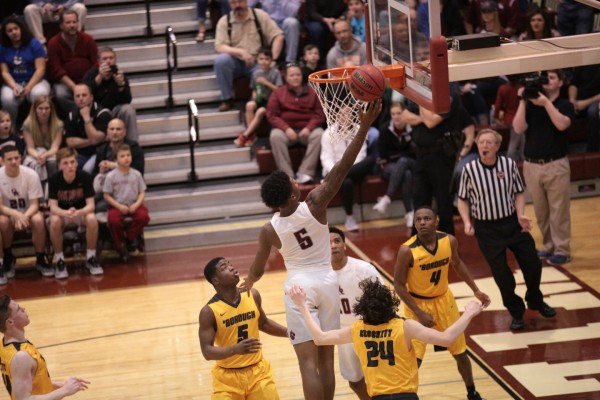 Oak Ridge senior Tee Higgins (5) goes for a layup during a 90-60 win for the Wildcats in a Class AAA sectional at Wildcat Arena on Monday, March 6, 2017. (Photo by Luther Simmons)