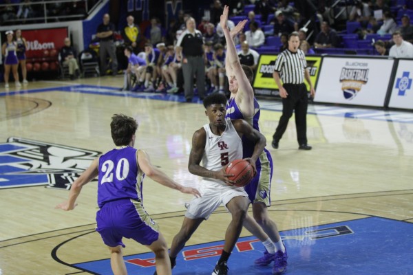 Oak Ridge senior Tee Higgins (5) drives to the basket during a 53-45 win over Brentwood in a Class AAA boys' state quarterfinal game at Murphy Center in Murfreesboro on Wednesday, March 15, 2017. (Photo by Luther Simmons)