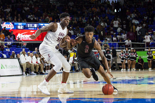 Oak Ridge senior Tee Higgins (5) drives against Memphis East sophomore Malcolm Dandridge (35) during a 63-60 loss for the Wildcats in a Class AAA boys' state semifinal game at Murphy Center in Murfreesboro on Friday, March 17, 2017. (Photo by Kindell Moore)