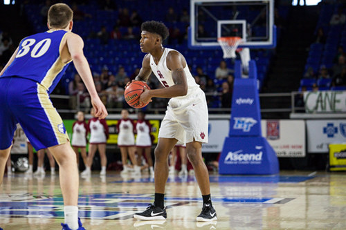 Oak Ridge senior Tee Higgins (5) looks for a pass during a 53-45 win over Brentwood in a Class AAA state quarterfinal game at Murphy Center in Murfreesboro on Wednesday, March 15, 2017. (Photo by Kindell Moore)