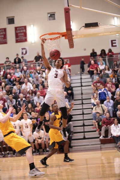Oak Ridge senior Tajion Jones (3) dunks the basketball during a 90-60 win for the Wildcats in a Class AAA sectional at Wildcat Arena on Monday, March 6, 2017. (Photo by Luther Simmons)