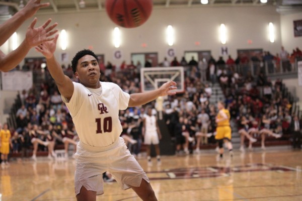 Oak Ridge junior Levert Smith (10) fights for a loose ball during a 90-60 win for the Wildcats in a Class AAA sectional at Wildcat Arena on Monday, March 6, 2017. (Photo by Luther Simmons)