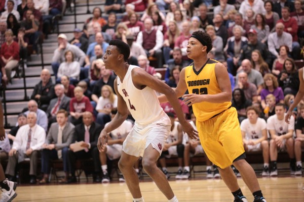 Oak Ridge senior Tyshawn Young (4) is pictured above with Camara Bradley (32) of David Crockett during a 90-60 win for the Wildcats in a Class AAA sectional at Wildcat Arena on Monday, March 6, 2017. (Photo by Luther Simmons)