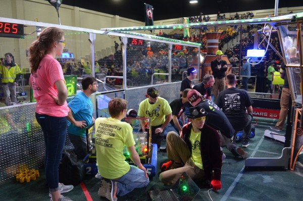 The Secret City Wildbots, an Oak Ridge team, competed in the FIRST Robotics Palmetto Regional in Myrtle Beach, South Carolina, on Saturday, March 4, 2017. Above, the Team 4265 drive team makes on-field adjustments during an unusually long time out, due to another team’s objection to the placement of teams on the field. The objection resulted in the replay of one match, with subsequent matches played out of order. One of the adjustments was to the shooter, yielding speed and accuracy. (Photo by Angi Agle)