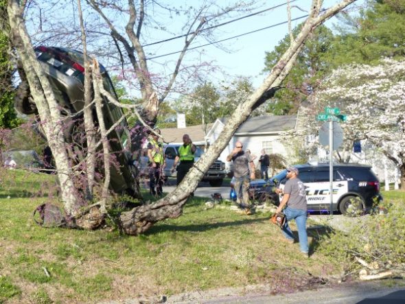 A Subaru Outback station wagon went off Delaware Avenue and appeared to have crashed into trees while airborne at a house at Dixie Lane on Thursday evening, April 13, 2017. (Photo by John Huotari/Oak Ridge Today)
