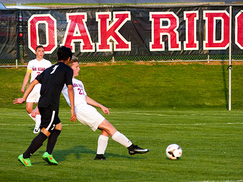 Oak Ridge sophomore defender Will Dallas (22) passes during a 6-0 win over Powell at the Oak Ridge Soccer Complex on Tuesday, April 11, 2017. (Photo by John Huotari/Oak Ridge Today)