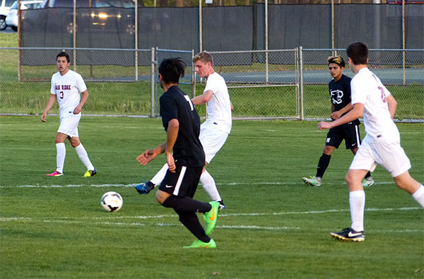 Oak Ridge senior defender Dean Stetzel (4) passes during a 6-0 win over Powell at the Oak Ridge Soccer Complex on Tuesday, April 11, 2017. (Photo by John Huotari/Oak Ridge Today)