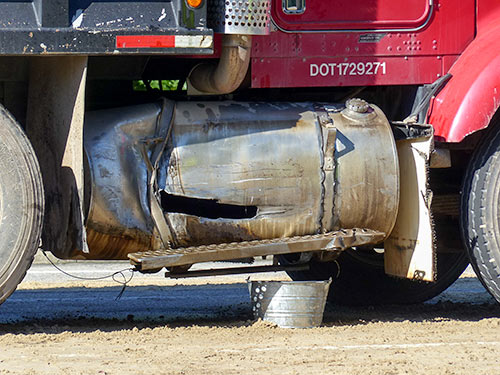 South Illinois Avenue remained closed early Friday afternoon, May 26, 2017, after about 100 gallons of diesel fuel spilled onto the road following a crash involving a dump truck and two vehicles at Lafayette Drive/Scarboro Road in south Oak Ridge. (Photo by John Huotari/Oak Ridge Today)