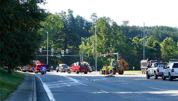 South Illinois Avenue remained closed early Friday afternoon, May 26, 2017, after about 100 gallons of diesel fuel spilled onto the road following a crash involving a dump truck and two vehicles at Lafayette Drive/Scarboro Road in south Oak Ridge. (Photo by John Huotari/Oak Ridge Today)