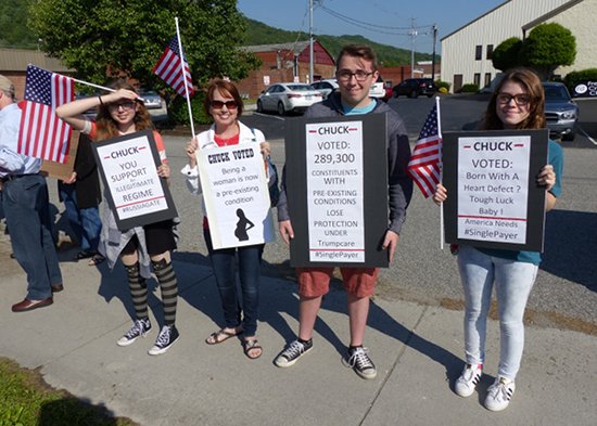 Protesters express their opposition to the health care vote in May by U.S. Representative Chuck Fleischmann, a Tennessee Republican, during a ribbon-cutting ceremony at the Rocky Top post office on May 9, 2017. (Photo by John Huotari/Oak Ridge Today)