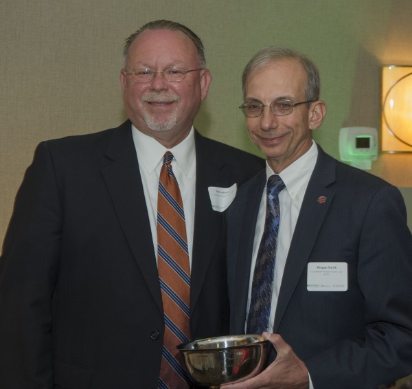 CNS President and CEO Morgan Smith, right, receives the Oak Ridge Chamber of Commerce’s Kerry Trammell Volunteer of the Year award from Oak Ridge Associated Universities Vice President and CFO Phil Andrews, who served as past chair of the Chamber’s board of directors. (Photo courtesy CNS)