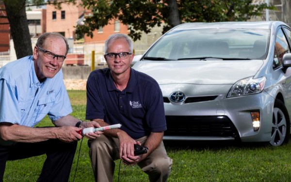 Oak Ridge National Laboratory’s Bruce Warmack, left, and Nance Ericson display an early prototype of the DC Hot Stick. (Photo: Carlos Jones, ORNL)