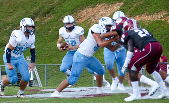 Hardin Valley junior quarterback Grayson Vaughn (10) scrambles during a 21-20 loss to Oak Ridge on Blankenship Field on Friday, Aug. 18, 2017. (Photo by John Huotari/Oak Ridge Today)
