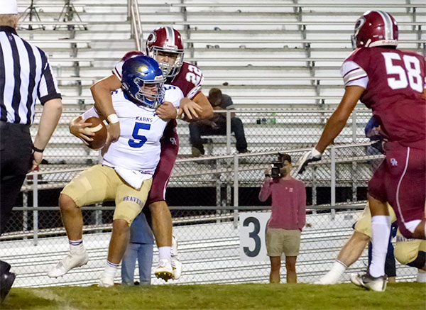 Oak Ridge senior linebacker Cobe Angel (22) and senior defensive lineman Adarius Cox (58) sack Karns junior quarterback Daniel Kitts (5) during a 49-3 homecoming win for the Wildcats on Blankenship Field on Friday, Sept. 29, 2017. (Photo by John Huotari/Oak Ridge Today)