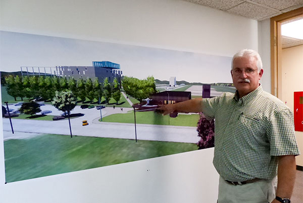 Artifact curator Steve Goodpasture, an environmental scientist for UCOR, the U.S. Department of Energy's cleanup contractor in Oak Ridge, shows the plans for the K-25 History Center, an Equipment Building, and Viewing Tower during a tour of the future home of the history center on the second floor of Oak Ridge Fire Station Number Four on Thursday, Oct. 19, 2017. (Photo by John Huotari/Oak Ridge Today)