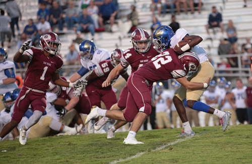 Members of the Oak Ridge defense pictured above are junior Jeremy Mitchell (1), sophomore Jacob Adams (44), and senior Cobe Angel (22) during a 49-3 homecoming win over Karns on Blankenship Field on Friday, Sept. 29, 2017. (Photo by Luther Simmons)