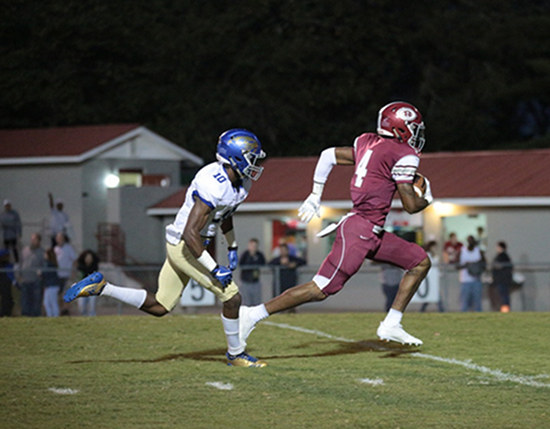 Oak Ridge senior wide receiver Caleb Martin (4) led receivers with 73 yards on four catches, including the touchdown reception pictured here, during a 49-3 homecoming win for the Wildcats on Blankenship Field on Friday, Sept. 29, 2017. Martin is defended here by Karns junior Thomas Harper (10). (Photo by Luther Simmons)