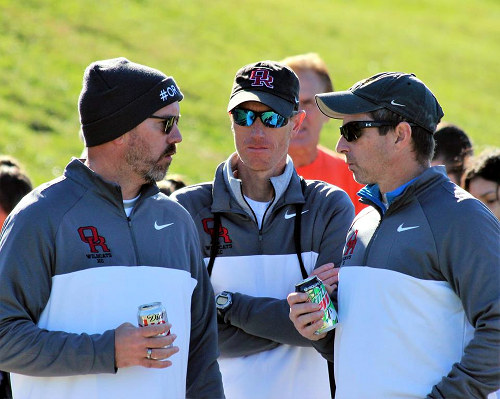 The Oak Ridge cross country coaches are pictured above at the Region 2 Large Division championship meet at Victor Ashe Park in Knoxville on Thursday, Oct. 26, 2017. Head Coach Ed Wright is at center with assistant coaches Tom Sauer, left, and Allen Etheridge. (Photo by Maddie Zawisza)