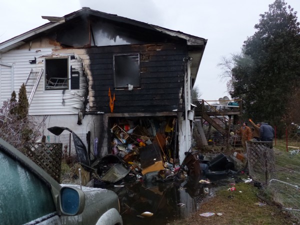 A man escaped with minor injuries, but a home was destroyed in a fire on Friday morning, Jan. 5, 2018, on Lindale Lane in west Oak Ridge. A bedroom floor had burned, and the bedroom had collapsed into the garage below. (Photo by John Huotari/Oak Ridge Today)