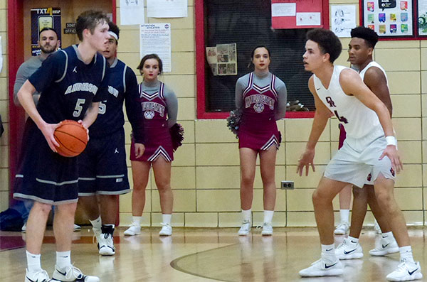 Spencer Chandler (5) of Anderson County and Seth Caldwell (4) of Oak Ridge in a District 3-AAA semifinal game at Halls on Friday, Feb. 16, 2018. (Photo by John Huotari/Oak Ridge Today)