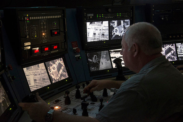 H Canyon Crane Operator Glenn Bowman lowers a High Flux Isotope Reactor core from Oak Ridge National Laboratory into the dissolver at the Savannah River Site in Aiken, S.C. (Photo courtesy U.S. Department of Energy Office of Environmental Management)
