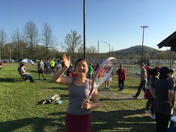 Oak Ridge Wildcats Tennis Jina Jiang is pictured above "mugging for the camera" near the many spectators who showed up for tennis matches at Oak Ridge High School on Thursday, April, 12, 2018. (Photo courtesy David Bowman)