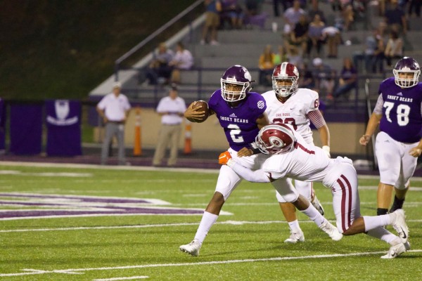 Oak Ridge senior Jeremy Mitchell (1) tackles Sevier County sophomore quarterback Cam Burden (2) during a 41-13 win at Sevier County on Friday, Sept. 21, 2018. (Photo by Barry Houchin)