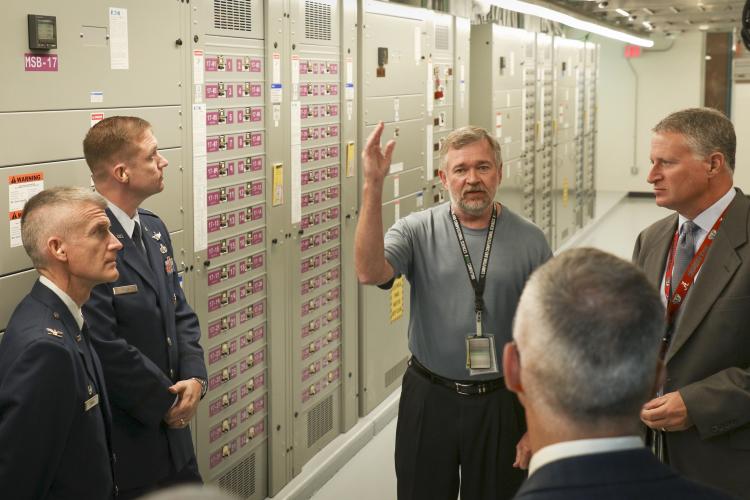 To extend its weather modeling capabilities, the U.S. Air Force has joined the computing experts at the U.S. Department of Energy’s Oak Ridge National Laboratory in a strategic collaboration that includes procurement and operation of a new high-performance weather modeling computer system. Key members of the Air Force and ORNL teams gathered on July 10, 2018, to kick off the project and tour the facilities supporting the new system. (Photo courtesy ORNL)