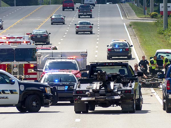 The Oak Ridge Police Department investigates a crash between a pickup truck and a riding lawn mower on South Illinois Avenue south of Lafayette Drive/Scarboro Road on Thursday afternoon, Sept. 13, 2018. (Photo by John Huotari/Oak Ridge Today)