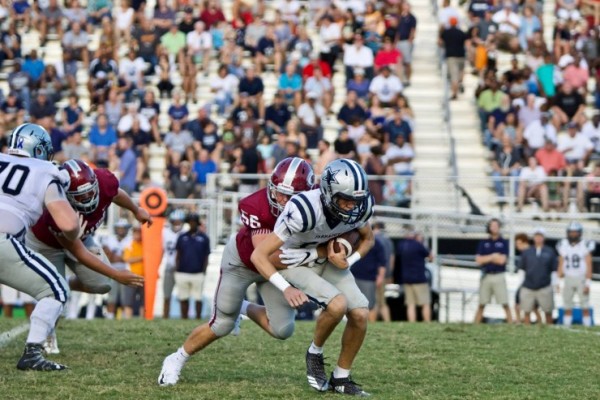 Oak Ridge junior Matthew Calhoun (56) tackles a Farragut player during a 20-14 loss to the Admirals on Blankenship Field on Friday, Sept. 7, 2018. (Photo by Barry Houchin)