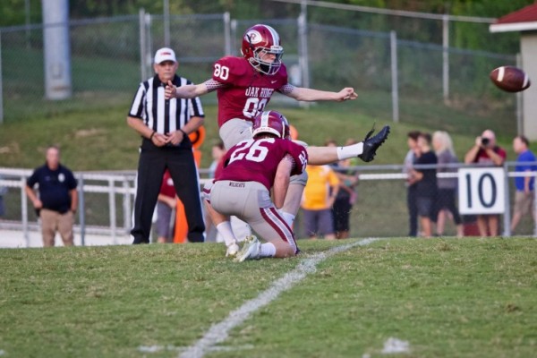 Oak Ridge sophomore Cam Mlekodaj (80) kicks the football as junior Jack Replogle (26) holds during a 20-14 loss to Farragut on Blankenship Field on Friday, Sept. 7, 2018. (Photo by Barry Houchin)