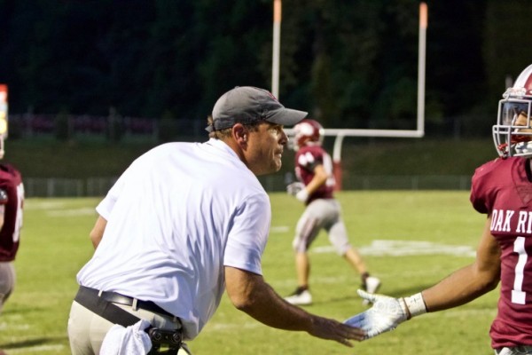 Oak Ridge assistant coach Jeff Miner is pictured above talking to Wildcats during a 41-12 win over Dobyns-Bennett on Friday, Aug. 24, 2018. (Photo by Barry Houchin)