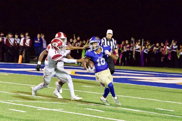 Oak Ridge senior Kjuan Stacy-Wright (16) tries to tackle Thomas Harper of Karns (10) during a 48-7 win over the Beavers on Friday, Sept. 28, 2018. (Photo by Barry Houchin)