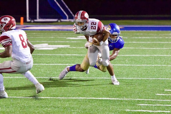 Oak Ridge sophomore Preston Turner (22) tries to break a tackle during a 48-7 win at Karns on Friday, Sept. 28, 2018. (Photo by Barry Houchin)