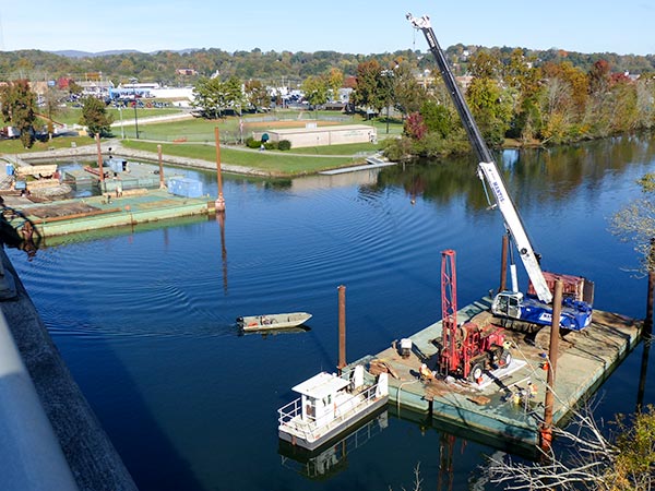 Work is under way on the bridge to replace the Honorable William Everette Lewallen Bridge over the Clinch River on Clinch Avenue between downtown Clinton and South Clinton. The work is pictured above on Tuesday, Oct. 30, 2018. (Photo by John Huotari/Oak Ridge Today)