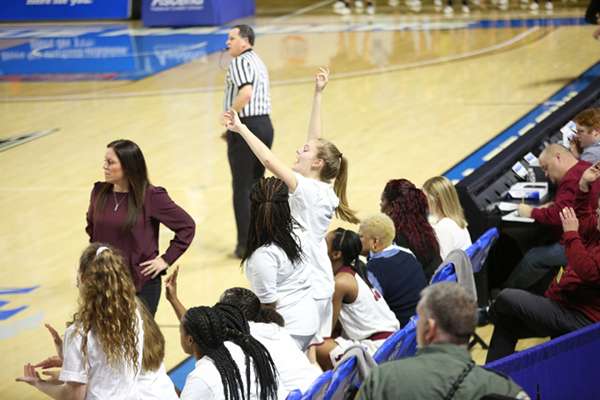 Oak Ridge junior Rachael Brewer (20) cheers on the Lady Wildcats during a 65-49 win for the Lady Wildcats over Science Hill in a Class AAA girls basketball tournament quarterfinal game in Murphy Center at Middle Tennessee State University in Mufreesboro on Thursday, March 7, 2019. (Photo by Luther Simmons)