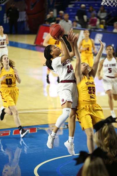 Senior Jada Guinn (24) has broken basketball records at Oak Ridge, including most points scored in a game and most points scored in a season. Guinn, a Miss Basketball finalist who has signed to play at Tennessee Tech, is pictured above shooting a layup during a 65-49 win over Science Hill in a Class AAA girls basketball tournament quarterfinal game in Murphy Center at Middle Tennessee State University in Mufreesboro on Thursday, March 7, 2019. (Photo by Luther Simmons)